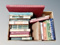 A box containing Folio Society volumes in slip covers
