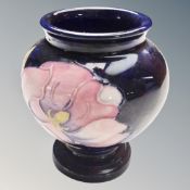 A Moorcroft Magnolia pattern squat vase, height 8.7cm.