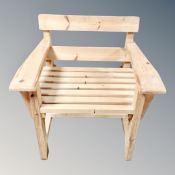 A pine slatted garden armchair