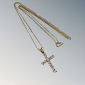 A 9ct yellow gold crucifix on chain set with cz