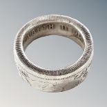 A silver Bermuda crown band ring