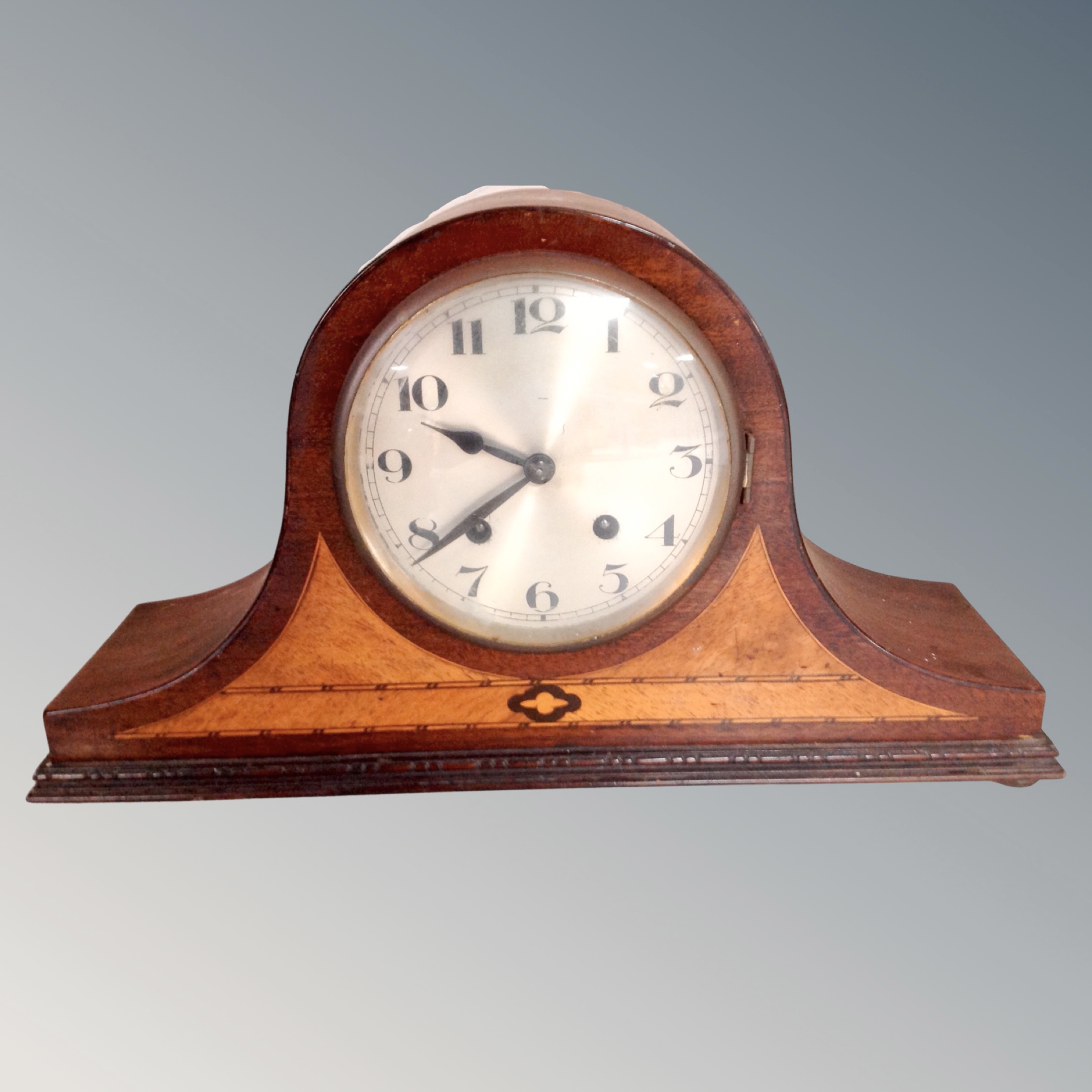 A late Victorian inlaid mahogany mantel clock with silvered dial