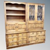 A twin section oak linen fold bureau bookcase
