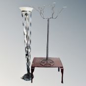 A metal embossed coffee table together with metal uplighter with glass shade and ten branch metal