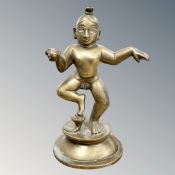 A late 19th century Tibetan cast brass figure of a dancing Buddha,