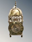 A brass lantern clock