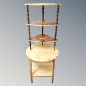 A contemporary pine circular two tier occasional table together with an Italian style three tier