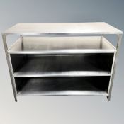 A stainless steel four tier catering preparation table