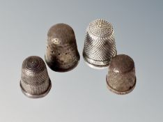 Four silver thimbles
