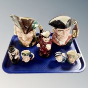 A tray of seven Royal Doulton character jugs, Robin Hood, Winston Churchill,