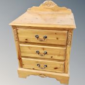 A Jaycee pine three drawer bedside chest
