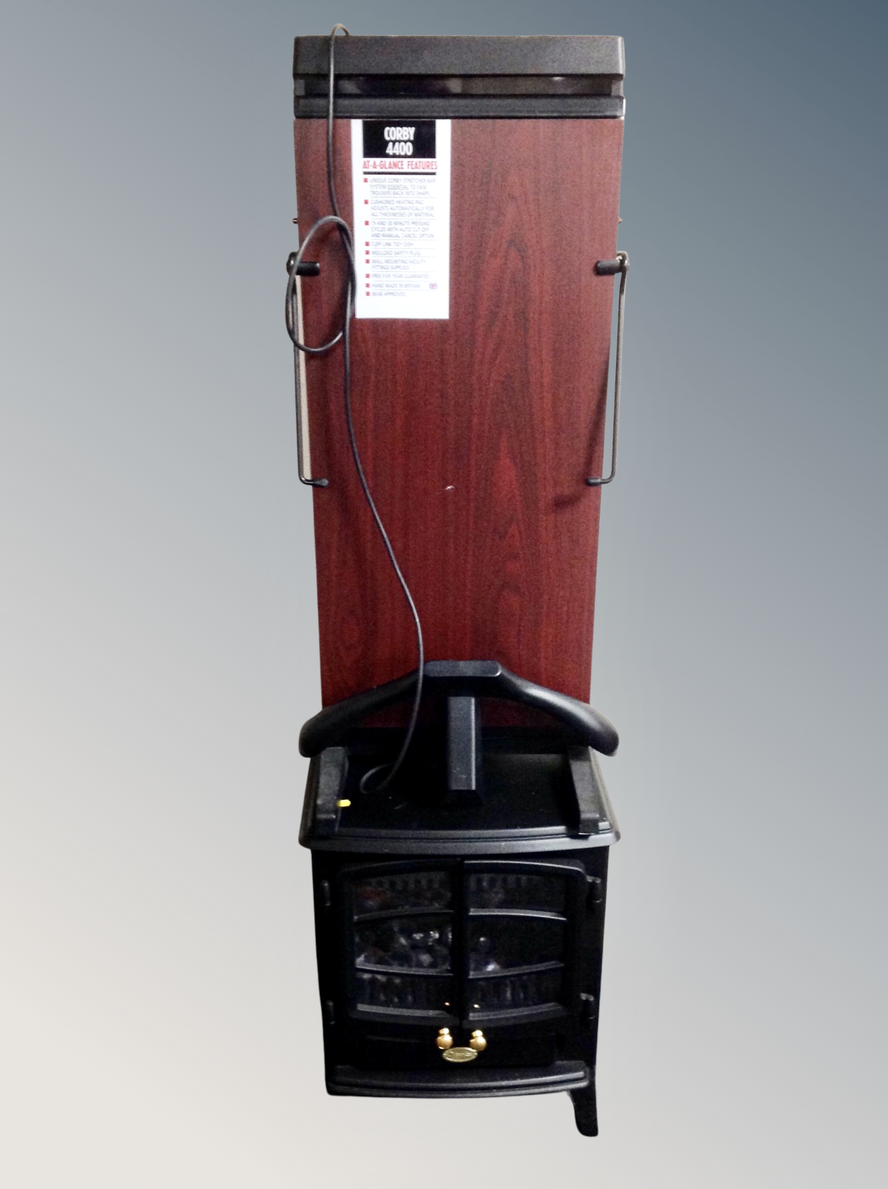 A Corby 440 trouser press together with a Dimplex heater in the form of a coal fire