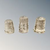 Three silver thimbles