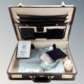 A revelation briefcase containing masonic apron and books
