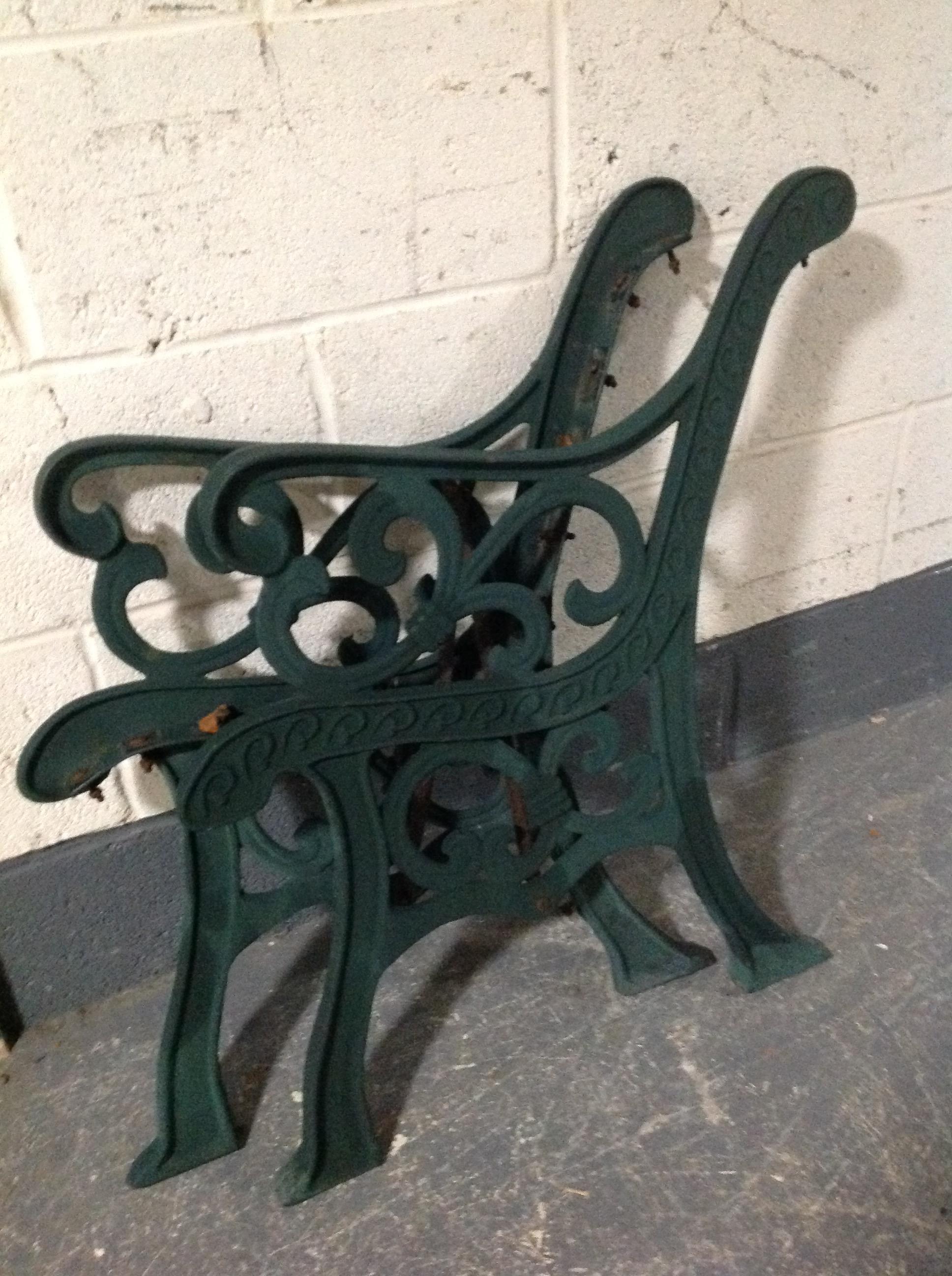 A pair of cast iron bench ends