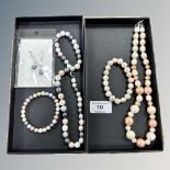 Two potato pearl and and faux pearl necklaces on silver clasps, each with matching bracelets,