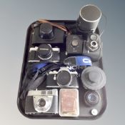 A tray containing cameras and accessories to include Olympus, Kodak,