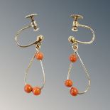 A pair of 9ct gold coral earrings with screw backs. CONDITION REPORT: 1.