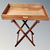 A late Victorian butler's tray on folding stand