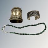 A white metal tribal cuff bracelet,