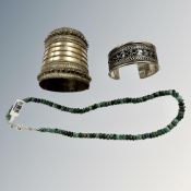 A white metal tribal cuff bracelet,