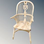 A pine Windsor kitchen armchair