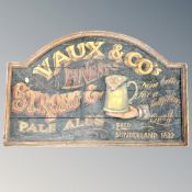 A Vaux and Co's wooden pub sign