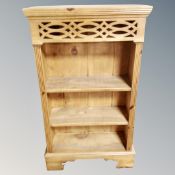 A pine low bookcase