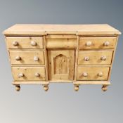 A Victorian pine inverted breakfronted sideboard