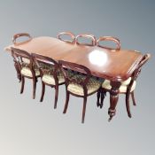 A Chapman's Siesta Victorian style wind out dining table with two leaves and handle together with a