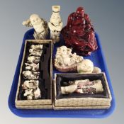 A tray of a collection of resin oriental Buddha figures and netsukes