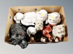 A box of assorted dog and cat ornaments