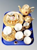 A tray of twenty one piece Czech tea service together with further Bavarian gilded and jewelled tea