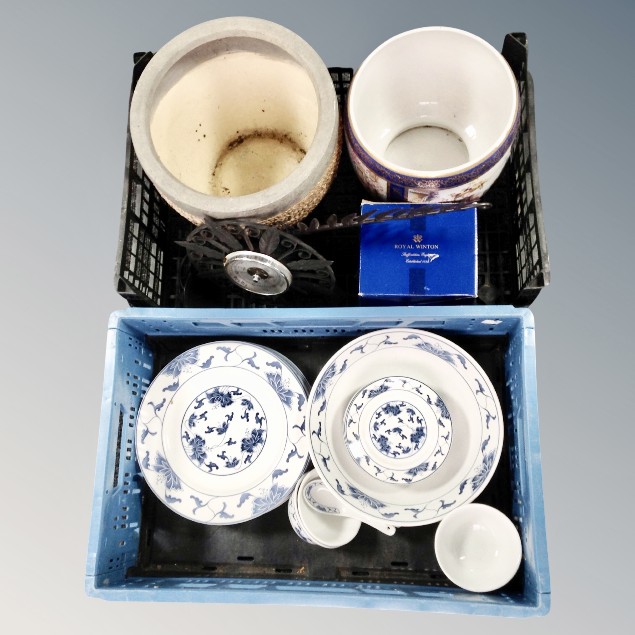 Two crates of Chinese blue and white dinner ware, ceramic and pottery planters,