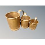 A graduated set of three vintage copper tankards