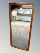 A 1970's teak framed mirror,