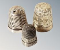 Three silver thimbles