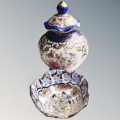 A Chinese lidded vase decorated with flowers,