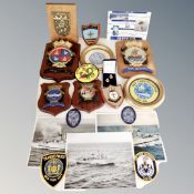 A box of naval items to include sew-on badges, plaques,