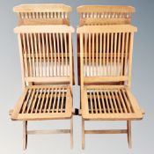 A set of four folding teak garden chairs