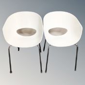 A pair of Italian Sintesi Orbit large moulded plastic chairs on metal legs