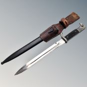 A German Third Reich parade bayonet in sheath with leather frog CONDITION REPORT: