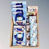 A box containing three Thomas and Friends Station Master cases together with four Thomas at the