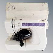 A Janome electric sewing machine with box