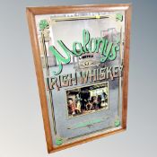 A Malony's Limited Irish Whiskey advertising mirror in frame