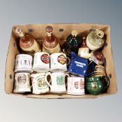 A box of Wade branded brewery jugs, Bells decanters to include two Old Scotch Whisky decanters,