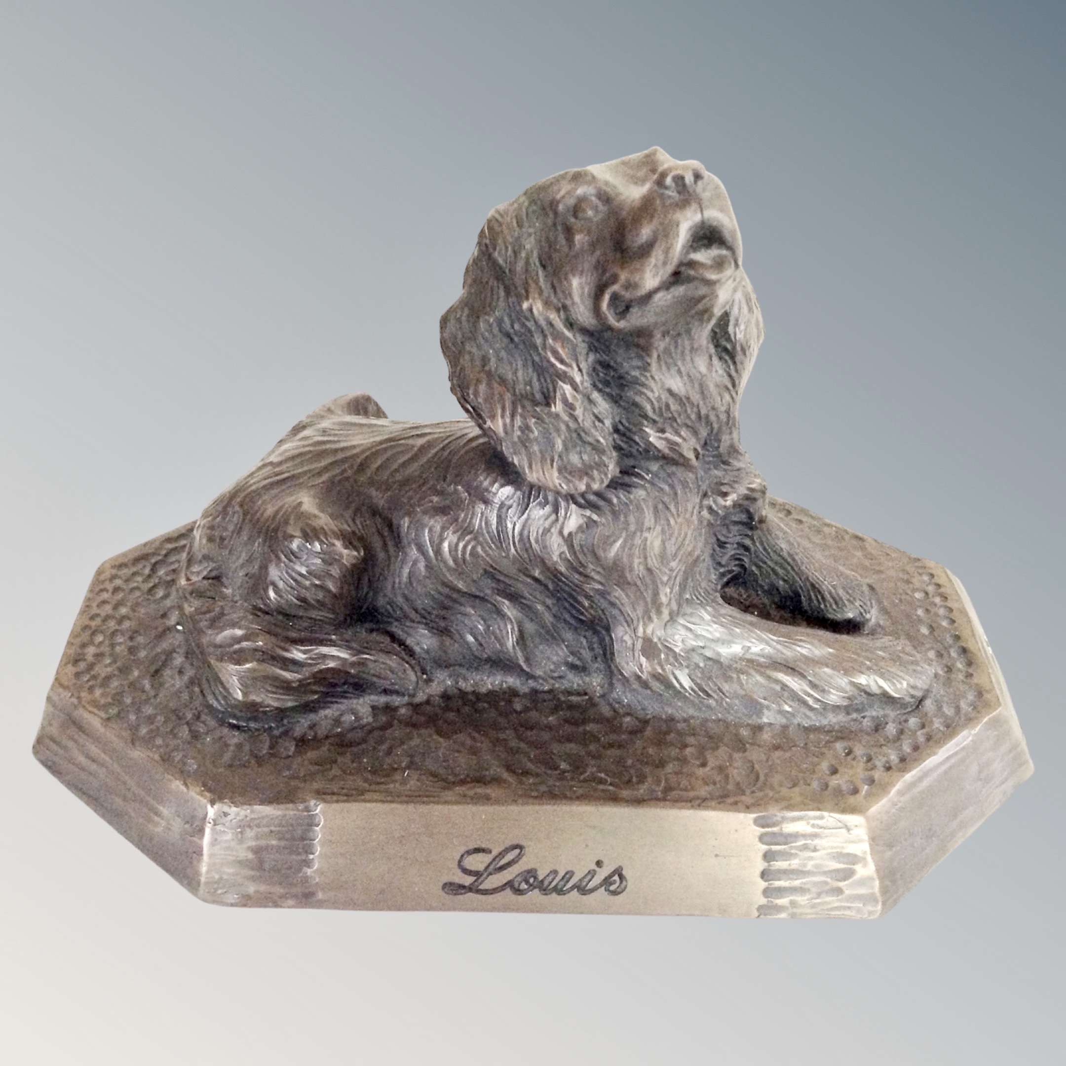 A contemporary bronzed composite figure of a terrier