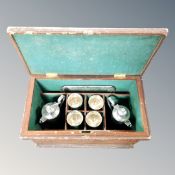 An eight piece 19th century silver plated wine set in fitted box comprising of pair of lidded jugs,