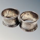 A pair of silver napkin rings,