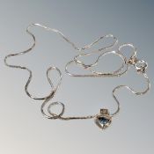 A silver blue topaz pendant chain